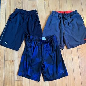 Men’s adult Medium, under armor, under armor, and Nike workout shorts.
